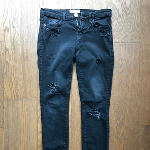 Black mid rise distressed skinny jeans